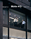 Omslag Motiv nr 13: två herrar i ett kontorsfönster