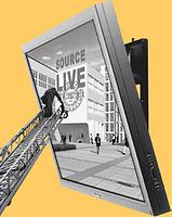 liten figur längst upp på en stege tittar på en stor skärm med bild på Konstfack